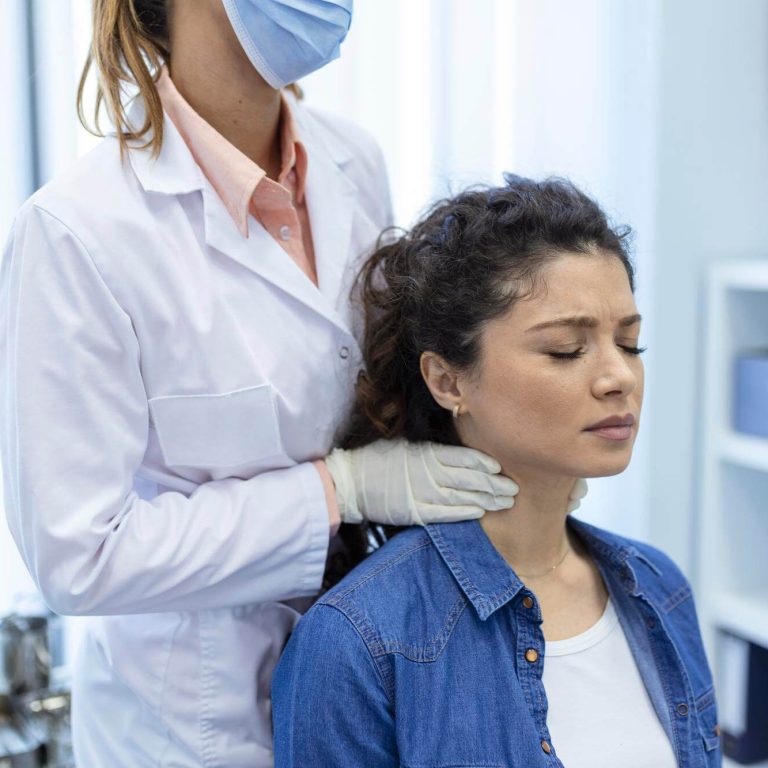 endocrinologist-examining-throat-young-woman-clinic-women-with-thyroid-gland-test-endocrinology-hormones-treatment-inflammation-sore-throat (1)